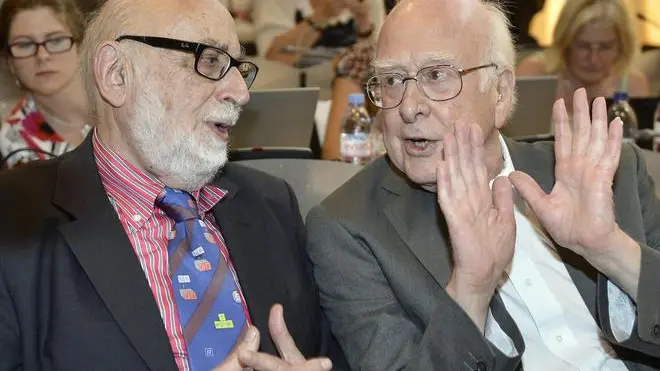 epa03901813 (FILES) Belgian physicist Francois Englert (L) and British physicist Peter Higgs (R), answer journalist's question about the scientific seminar to deliver the latest update in the search for the Higgs boson at the European Organization for Nuclear Research (CERN) in Meyrin near Geneva, Switzerland, 04 July 2012. The two scientists have won the Nobel prize in physics for their work on the theory of the Higgs boson, it was announced 08 October 2013. Peter Higgs, from the UK, and Francois Englert from Belgium, shared the prize. EPA/MARTIAL TREZZINI