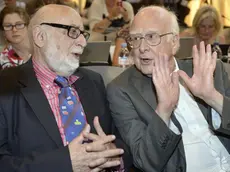 epa03901813 (FILES) Belgian physicist Francois Englert (L) and British physicist Peter Higgs (R), answer journalist's question about the scientific seminar to deliver the latest update in the search for the Higgs boson at the European Organization for Nuclear Research (CERN) in Meyrin near Geneva, Switzerland, 04 July 2012. The two scientists have won the Nobel prize in physics for their work on the theory of the Higgs boson, it was announced 08 October 2013. Peter Higgs, from the UK, and Francois Englert from Belgium, shared the prize. EPA/MARTIAL TREZZINI