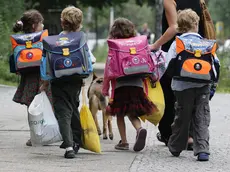 BERLIN - AUGUST 23: Children walk down the way on the first school day on August 23, 2010 in Berlin, Germany. Many German school districts, including those in Berlin, are reducing the school times pan from 13 to 12 years as part of a nationwide set of primary and secondary school reforms.. (Photo by Andreas Rentz/Getty Images)