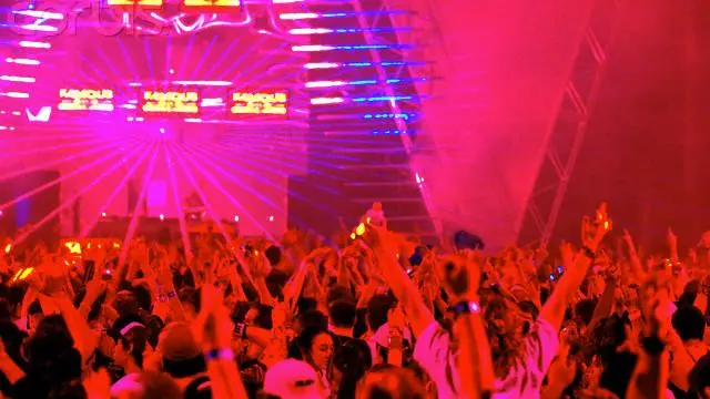 07 Jul 2006, Melbourne, Australia --- Party goers wave their hands in the air, as laser lights streak across the room at a rave dance party. --- Image by © Julian Smith/Corbis