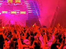 07 Jul 2006, Melbourne, Australia --- Party goers wave their hands in the air, as laser lights streak across the room at a rave dance party. --- Image by © Julian Smith/Corbis