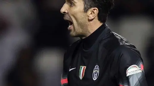 Juventus FC's Italian goalkeeper and captain Gianluigi Buffon reacts after saving a penalty shot during the Italian Super Cup against Napoli, at the Sheikh Jassim Bin Hamad Stadium, in the Qatari capital, Doha on Monday Dec. 22, 2014. (AP Photo/Osama Faisal)