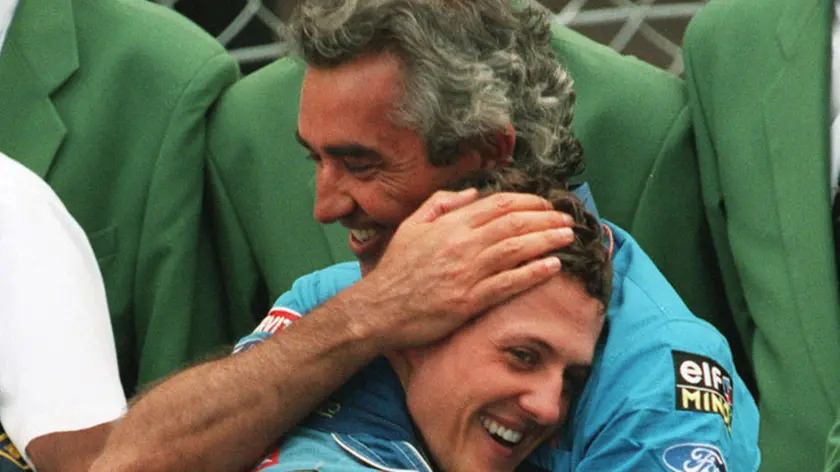 Foto LaPresse.FOTO DI REPERTORIO.04/06/2014.Schumacher, non avremo pi buone notizie....FILE - In this May 15, 1994 file photo, Benetton team manager Flavio Briatore, right, hugs German driver Michael Schumacher, foreground, after his victory in the Formula One Monaco Grand Prix. On Wednesday, Sept. 16, 2009 Renault said managing director Flavio Briatore and engineering chief executive Pat Symonds are leaving the Formula One team, and that it will not dispute charges that Nelson Piquet Jr. was ordered to crash in a race. Renault has been summoned to Paris by governing body FIA to answer a charge that Piquet Jr. was told to crash at last year's Singapore Grand Prix to improve teammate Fernando Alonso's chances of victory. The Spaniard won the race. Renault said it "will not dispute the recent allegations made by the FIA concerning the 2008 Singapore Grand Prix. (AP Photo/Lionel Cironneau, files)