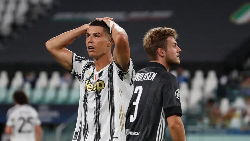 Juventus\' Cristiano Ronaldo reacts during the Champions League round of 16 second leg, soccer match between Juventus and Lyon at the Allianz stadium in Turin, Italy, Friday, Aug. 7, 2020. (AP Photo/Antonio Calanni)
