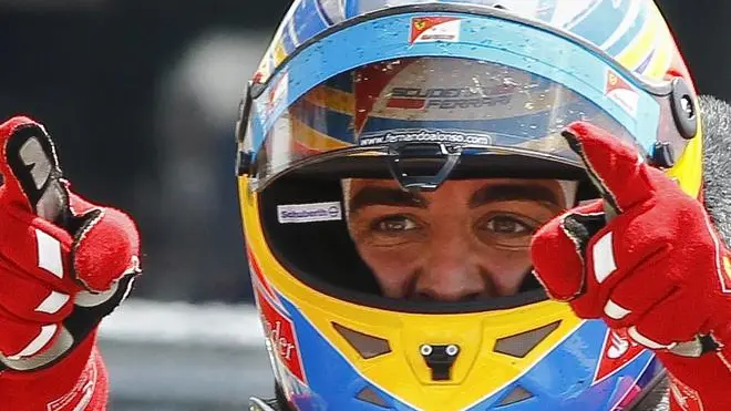 epa02818052 Winner Spanish Formula One driver Fernando Alonso of Scuderia Ferrari celebrates after the 2011 Formula One Grand Prix of Great Britain at the Silverstone race track in Northamptonshire, Britain, 10 July 2011. EPA/VALDRIN XHEMAJ