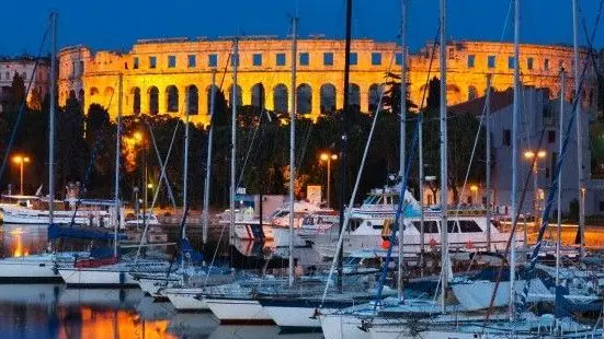 13 May 2007, Pula --- Dusk over marina and the Roman Amphitheatre, Pula, Istria, Croatia, Adriatic, Europe --- Image by © Stuart Black/Robert Harding World Imagery/Corbis