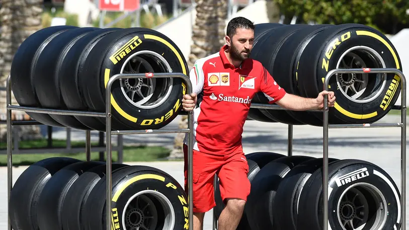 21 Feb 2014, Sakhir, Bahrain --- Ferrari mechanic with Pirelli tyres. Formula One Testing, Day Three, Bahrain International Circuit, Sakhir, Bahrain, Friday 21 February 2014. --- Image by © Sutton Images/Corbis