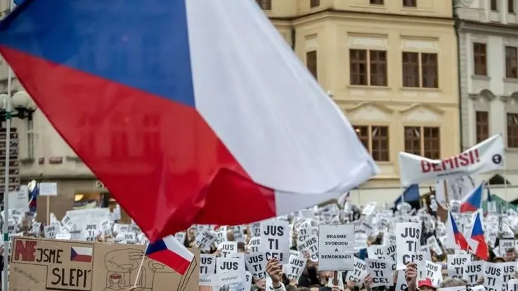 epa07536781 People hold banners reading 'Justice' as thousands of demonstrators gather at the Old Town Square to protest against Czech Prime Minister Andrej Babis and new Minister of Justice in Prague, Czech Republic, 29 April 2019. According to reports, 4.000 people protest against appointing Marie Benesova as new justice minister and for free justice. Babis is suspected of alleged misuse of EU subsidies in a total of 50 million Czech crowns (1.9 milion euro) which were invested into the Capi hnizdo (Stork's Nest) farm in Central Bohemia. The EU's fraud office OLAF is investigating the case. EPA-EFE/MARTIN DIVISEK