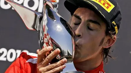 Spanish Formula One driver Fernando Alonso of Scuderia Ferrari kisses the trophy on the podium after winning the 2012 Formula One Grand Prix of Europe at the Valencia street circuit in Valencia, Spain, 24 June 2012. ANSA/MANUEL BRUQUE