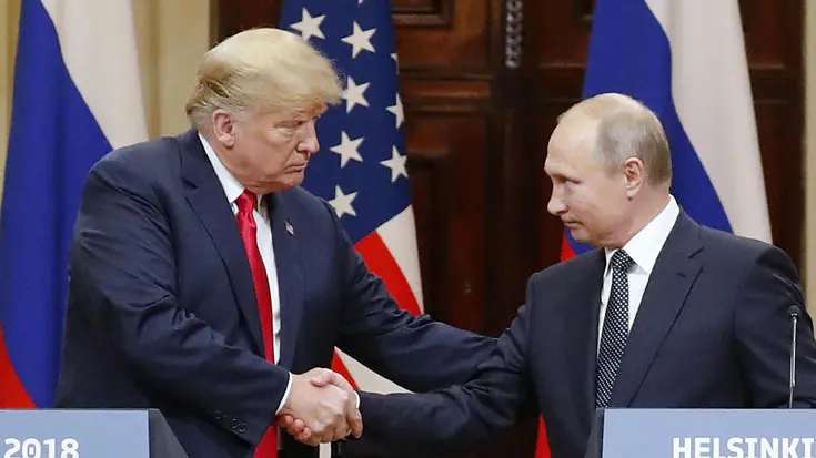 epa06893248 US President Donald J. Trump (L) and Russian President Vladimir Putin (R) shake hands during a joint press conference in the Hall of State at Presidential Palace following their summit talks, in Helsinki, Finland, 16 July 2018. EPA/ANATOLY MALTSEV