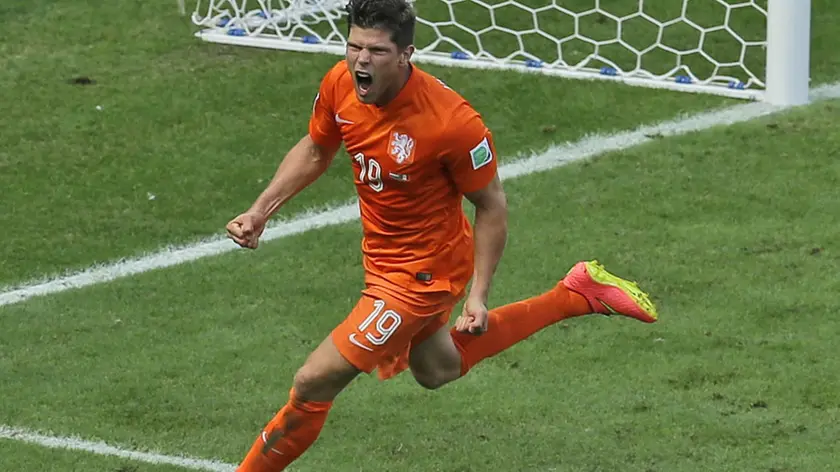 Netherlands' Klaas-Jan Huntelaar celebrates after scoring his side's second goal from the penalty spot during the World Cup round of 16 soccer match between the Netherlands and Mexico at the Arena Castelao in Fortaleza, Brazil, Sunday, June 29, 2014. Holland won 2-1 and advanced to the quarterfinal. (AP Photo/Themba Hadebe)
