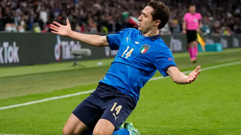 Italy's Federico Chiesa celebrates after scoring his side's opening goal during the Euro 2020 soccer semifinal match between Italy and Spain at Wembley stadium in London, Tuesday, July 6, 2021. (AP Photo/Frank Augstein, Pool)
