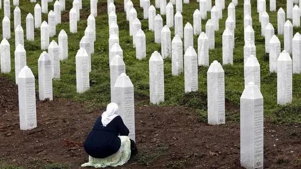 epaselect epa07709240 A Bosnian Muslim woman prays during the funeral in the Potocari Memorial Center, Srebrenica, Bosnia and Herzegovina, 11 July 2019, where 33 newly-identified Bosnian Muslims were burried. The burial was part of a memorial ceremony to mark the 24th anniversary of the Srebrenica massacre on 11 July 2019, considered the worst atrocity of Bosnia's 1992-95 war. More than 8,000 Muslim men and boys were executed in the 1995 killing spree after Bosnian Serb forces captured the former Bosnian Muslim enclave in Srebrenica on 11 July 1995. EPA/FEHIM DEMIR