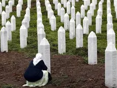 epaselect epa07709240 A Bosnian Muslim woman prays during the funeral in the Potocari Memorial Center, Srebrenica, Bosnia and Herzegovina, 11 July 2019, where 33 newly-identified Bosnian Muslims were burried. The burial was part of a memorial ceremony to mark the 24th anniversary of the Srebrenica massacre on 11 July 2019, considered the worst atrocity of Bosnia's 1992-95 war. More than 8,000 Muslim men and boys were executed in the 1995 killing spree after Bosnian Serb forces captured the former Bosnian Muslim enclave in Srebrenica on 11 July 1995. EPA/FEHIM DEMIR