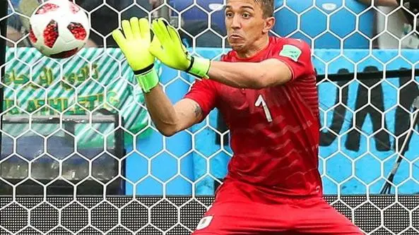 epa06868590 Uruguay's goalkeeper Fernando Muslera concedes Uruguay's 2-0 lead during the FIFA World Cup 2018 quarter final soccer match between Uruguay and France in Nizhny Novgorod, Russia, 06 July 2018. (RESTRICTIONS APPLY: Editorial Use Only, not used in association with any commercial entity - Images must not be used in any form of alert service or push service of any kind including via mobile alert services, downloads to mobile devices or MMS messaging - Images must appear as still images and must not emulate match action video footage - No alteration is made to, and no text or image is superimposed over, any published image which: (a) intentionally obscures or removes a sponsor identification image; or (b) adds or overlays the commercial identification of any third party which is not officially associated with the FIFA World Cup) EPA/VASSIL DONEV EDITORIAL USE ONLY