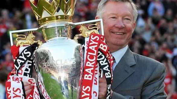 epa03691634 (FILE) File picture dated 22 May 2011 of Manchester United's Manager Sir Alex Ferguson with the Premier League Trophy at the end of the Premier League game between Manchester United and Blackpool at Old Trafford Manchester, Britain. Sir Alex Ferguson will retire as manager of Manchester United at the end of the season, the club confirmed on 08 May 2013. The Scot has been in charge since 1986 and won 13 league titles, two Champions League titles and numerous other competitions with the club. EPA/ROBIN PARKER DataCo terms and conditions apply. https://www.epa.eu/downloads/DataCo-TCs.pdf