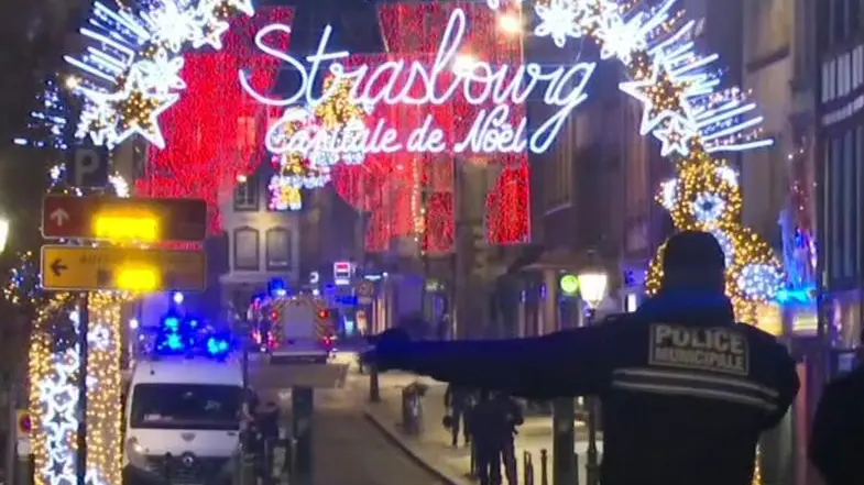 In this image made from video, emergency services arrive on the scene of a Christmas market in Strasbourg, France, Tuesday, Dec. 11, 2018. A French regional official says that a shooting in Strasbourg has left at least one dead and several wounded in the city center near a world-famous Christmas market. The prefect of France's Bas-Rhin region says the gunman, who is still at large, has been identified. Authorities haven't given a motive for the shooting. (ANSA/AP Photo)