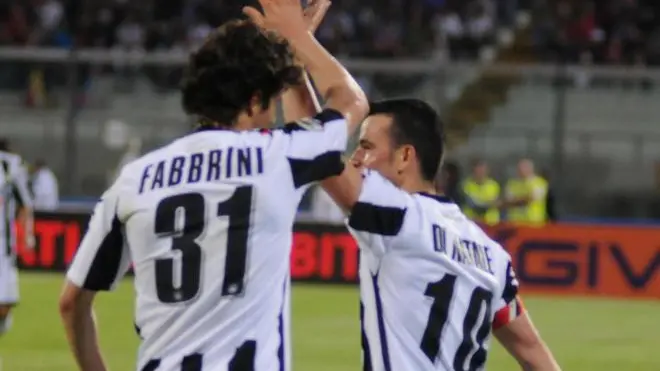 Italian forward Antonio Di Natale (R) of Udinese Calcio jubilates with his teammate Diego Fabbrini (L) after scoring the 1-0 against Catania Calcio during their italian Serie A soccer match at Angelo Massimino Stadium in Catania, 13 May 2012. ANSA/MASSIMO DAGATA