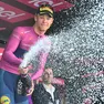 Italian rider Jonathan Milan of Lidl-Trek team retaining the points classification leader's cyclamen jersey, celebrate on the podium after 20th stage of the 107 Giro d'Italia 2024, cycling race over 184 km from Alpago to Bassano del Grappa, Italy, 25 May 2024. ANSA/LUCA ZENNARO
