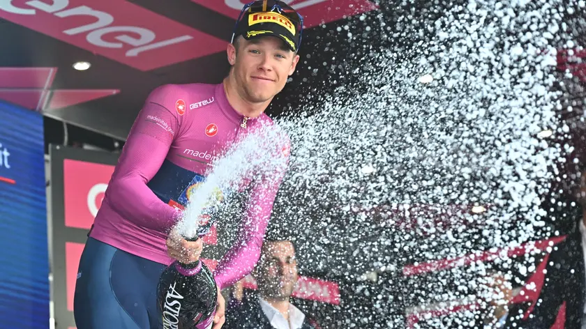 Italian rider Jonathan Milan of Lidl-Trek team retaining the points classification leader's cyclamen jersey, celebrate on the podium after 20th stage of the 107 Giro d'Italia 2024, cycling race over 184 km from Alpago to Bassano del Grappa, Italy, 25 May 2024. ANSA/LUCA ZENNARO