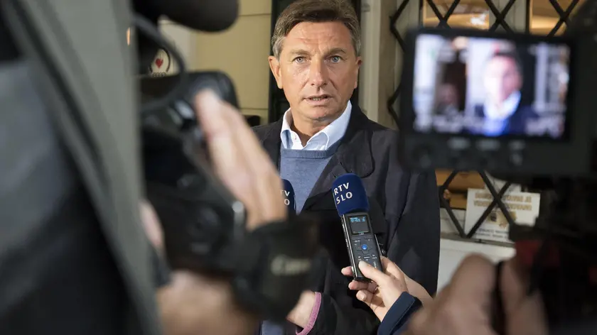 epa06281805 Borut Pahor, the incumbent Slovenian President, speaks to the media after casting his vote during the Slovenian Presidential Elections, at polling station in Nova Gorica, Slovenia, 22 October 2017. If no candidate receives a majority of the vote, a run-off will be held within the next three weeks. EPA/IGOR KUPLJENIK