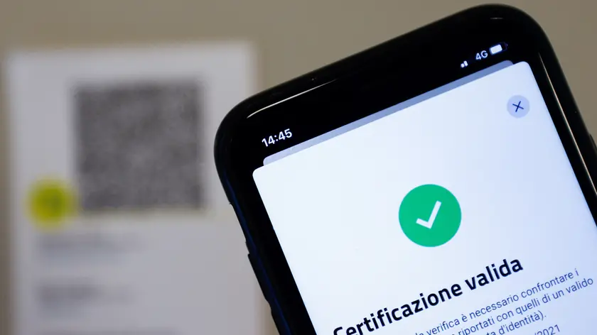 The VerificaC19 app, a smartphone app designed to scan and check the Green Pass (health pass) which has become mandatory to access an array of services and leisure activities, is seen on a mobile phone, amid the coronavirus disease (COVID-19) pandemic, in this illustration picture taken in Rome, Italy, August 5, 2021. Picture taken August 5, 2021. REUTERS/Guglielmo Mangiapane/Illustration