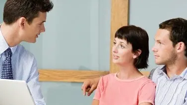 Couple meeting financial advisor --- Image by © Image Source/Corbis