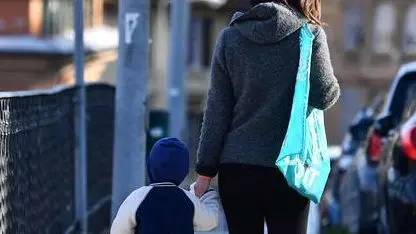 One of the very few mothers with her baby traveling around the city, Genova, Italy, 30 March 2020. Countries around the world are taking measures to stem the widespread of the SARS-CoV-2 coronavirus which causes the Covid-19 disease. ANSA/LUCA ZENNARO