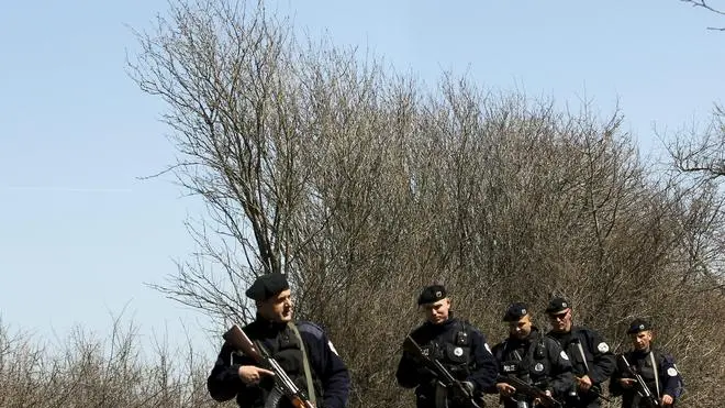 epa03168938 Kosovo police officers patrol the border area between Kosovo and Serbia, near Merdare, Kosovo, 02 April 2012. Reports state that two Kosovo policemen have been released by Serbian authorities after they were arrested, armed with pistols, automatic rifles and surveillance equipment, by Serbian police early on 31 March 2012 in the region of Merdare, southern Serbia. EPA/VALDRIN XHEMAJ