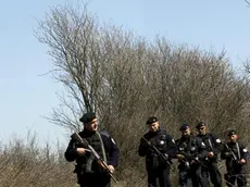 epa03168938 Kosovo police officers patrol the border area between Kosovo and Serbia, near Merdare, Kosovo, 02 April 2012. Reports state that two Kosovo policemen have been released by Serbian authorities after they were arrested, armed with pistols, automatic rifles and surveillance equipment, by Serbian police early on 31 March 2012 in the region of Merdare, southern Serbia. EPA/VALDRIN XHEMAJ