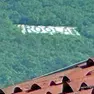 Rogla, w Roglic e la scritta per Tito per un po’ cambia sul Monte Sabotino