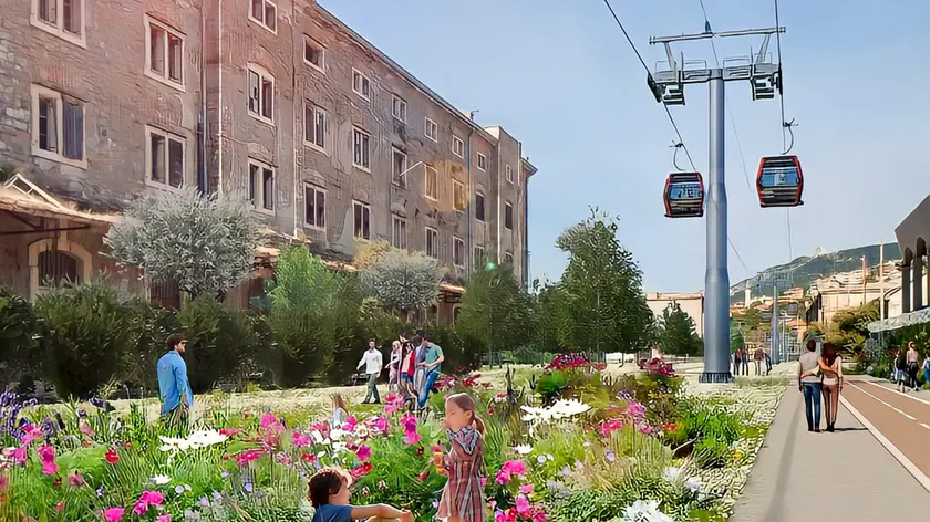 Un render della cabinovia mentre sorvola i magazzini di Porto Vecchio