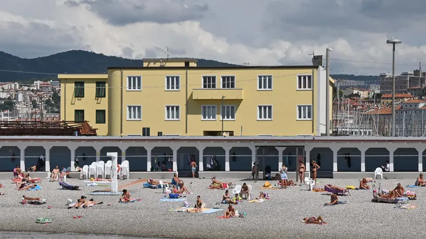 Bagnanti nella spiaggia del Pedocin Foto Bruni