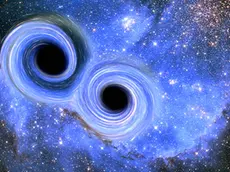 La rappresentazione di una collisione fra buchi neri (foto Agf)