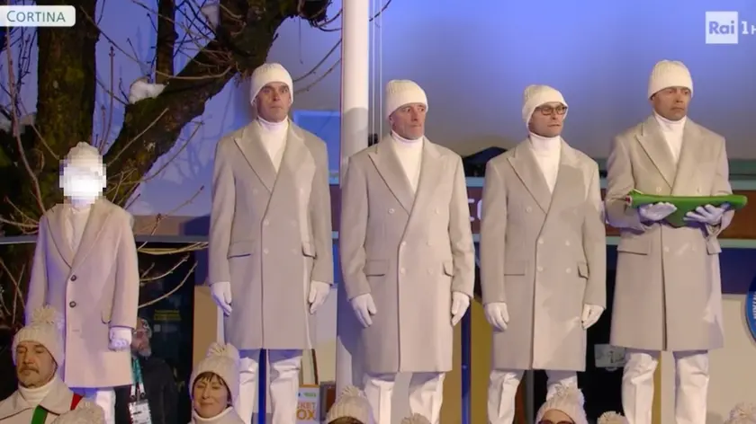 Riccardo, a sinistra, e a destra la staffetta d'oro del fondo a Torino 2006