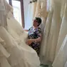 Rosella Lorenzetto, referente della Caritas di Paese, tra gli abiti da sposa dell'Atelier solidale