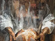 Il dettaglio delle mani e del pane dall'opera "Cena in Emmaus"