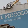 Restaurata la storica scritta de Il Piccolo