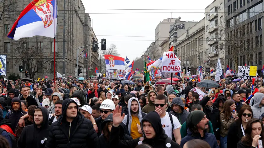 epa11966398 Protesters wave Serbian flags during the student-led rally in Belgrade, Serbia, 15 March 2025. University students staged a protest, demanding accountability after fifteen people lost their lives in the collapse of the Novi Sad Railway Station canopy in November 2024. The station building, which had been renovated and reopened in July 2024, was undergoing further renovations shortly before the collapse. EPA/ANDREJ CUKIC