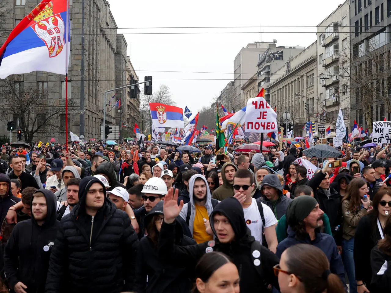 epa11966398 Protesters wave Serbian flags during the student-led rally in Belgrade, Serbia, 15 March 2025. University students staged a protest, demanding accountability after fifteen people lost their lives in the collapse of the Novi Sad Railway Station canopy in November 2024. The station building, which had been renovated and reopened in July 2024, was undergoing further renovations shortly before the collapse. EPA/ANDREJ CUKIC