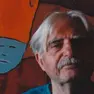 L'artista Ugo Pierri ritratto davanti a uno dei suoi disegni