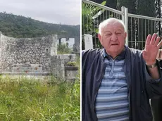 A sinistra il muro perimetrale che rimane della chiesetta, a destra il parroco don Ambrož Kodelja