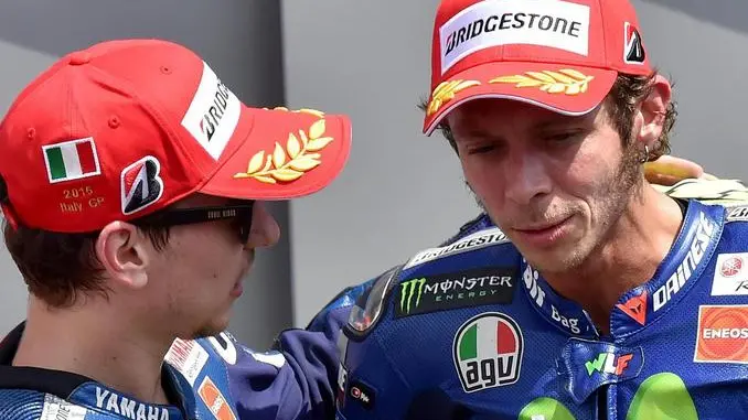 Spanish MotoGP rider Jorge Lorenzo (L) of the Movistar Yamaha team celebrates in the finish area after winning the Grand Prix of Italy at the Mugello circuit, Scarperia, central Italy, 31 May 2015. Italian MotoGP rider Andrea Iannone (not pictured) of the Ducati Team took the second place ahead of Italian MotoGP rider Valentino Rossi (R) of the Movistar Yamaha team. ANSA/ETTORE FERRARI