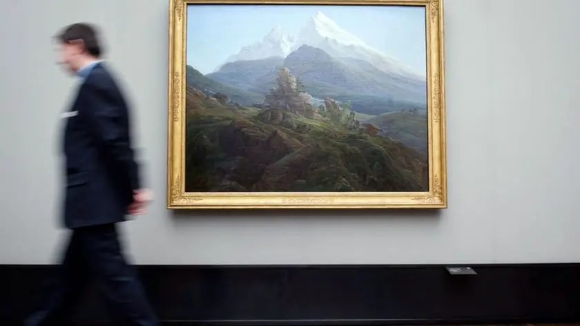 24 Apr 2014, Berlin, Germany --- A man walks past a painting "The Watzmann" (1824/25) by Caspar David Friedrich in the Alte Nationalgalerie in Berlin, Germany, 24 April 2014. The Gurlitt case has rekindled the debate around artwork stolen by the Nazis. German museums are coming under more scrutiny. Photo: DANIEL NAUPOLD/dpa --- Image by © Daniel Naupold/dpa/Corbis