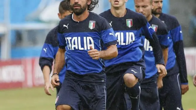 epa04274939 Italian midfielder Andrea Pirlo and teammates during an official training session of the Italian team at the stadium Arena das Dunas in Natal, Brazil on 23 June 2014. Italy will face Uruguay in their group D preliminary round match at the FIFA World Cup 2014 on 24 June 2014 in Natal. (RESTRICTIONS APPLY: Editorial Use Only, not used in association with any commercial entity - Images must not be used in any form of alert service or push service of any kind including via mobile alert services, downloads to mobile devices or MMS messaging - Images must appear as still images and must not emulate match action video footage - No alteration is made to, and no text or image is superimposed over, any published image which: (a) intentionally obscures or removes a sponsor identification image; or (b) adds or overlays the commercial identification of any third party which is not officially associated with the FIFA World Cup) EPA/KAMIL KRZACZYNSKI EDITORIAL USE ONLY