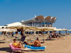 La spiaggia di Lignano Sabbiadoro (Foto di archivio)