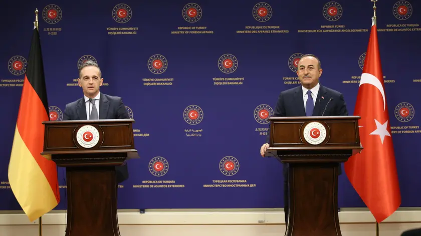 epa08946053 A handout photo made available by the Turkish Foreign Ministry Press Office shows Turkish Minister of Foreign Affairs Mevlut Cavusoglu (R) and German Foreign Minister Heiko Maas (L) during a press conference after their meeting in Ankara, Turkey, 18 January 2021. EPA/CEM OZDEL / TURKISH FOREIGN MINISTERY PRESS OFFICE HANDOUT HANDOUT EDITORIAL USE ONLY/NO SALES