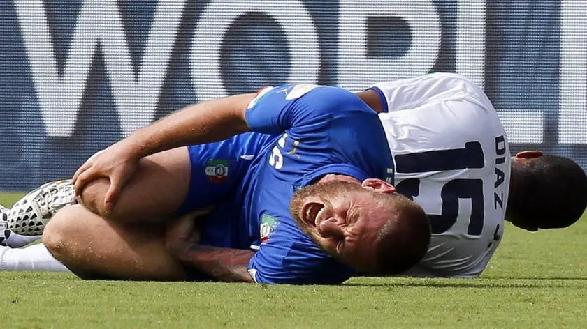epa04269226 Junior Diaz (R) of Costa Rica and Daniele De Rossi (L) of Italy lie on the pitch following a tackle during the FIFA World Cup 2014 group D preliminary round match between Italy and Costa Rica at the Arena Pernambuco in Recife, Brazil, 20 June 2014. (RESTRICTIONS APPLY: Editorial Use Only, not used in association with any commercial entity - Images must not be used in any form of alert service or push service of any kind including via mobile alert services, downloads to mobile devices or MMS messaging - Images must appear as still images and must not emulate match action video footage - No alteration is made to, and no text or image is superimposed over, any published image which: (a) intentionally obscures or removes a sponsor identification image; or (b) adds or overlays the commercial identification of any third party which is not officially associated with the FIFA World Cup) EPA/CHEMA MOYA EDITORIAL USE ONLY