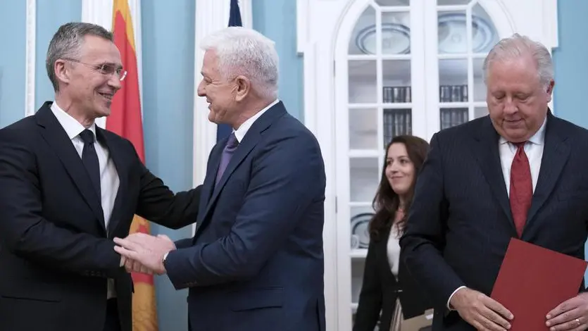 epa06012309 NATO Secretary General Jens Stoltenberg (L) shakes hands with Prime Minister of Montenegro Dusko Markovic (C), with US Under Secretary of State Thomas Shannon (R), during an accession ceremony for Montenegro into the NATO alliance at the State Department in Washington, DC, USA, 05 June 2017. Montenegro becomes the 29th NATO ally. EPA/SHAWN THEW