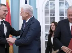 epa06012309 NATO Secretary General Jens Stoltenberg (L) shakes hands with Prime Minister of Montenegro Dusko Markovic (C), with US Under Secretary of State Thomas Shannon (R), during an accession ceremony for Montenegro into the NATO alliance at the State Department in Washington, DC, USA, 05 June 2017. Montenegro becomes the 29th NATO ally. EPA/SHAWN THEW